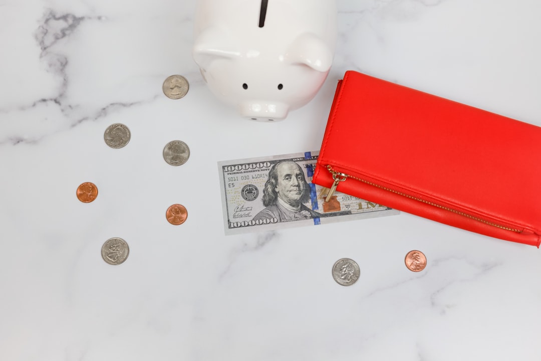This feminine styled stock photo features money, cash, and coins and is perfect for business, accounting, or personal finance content.